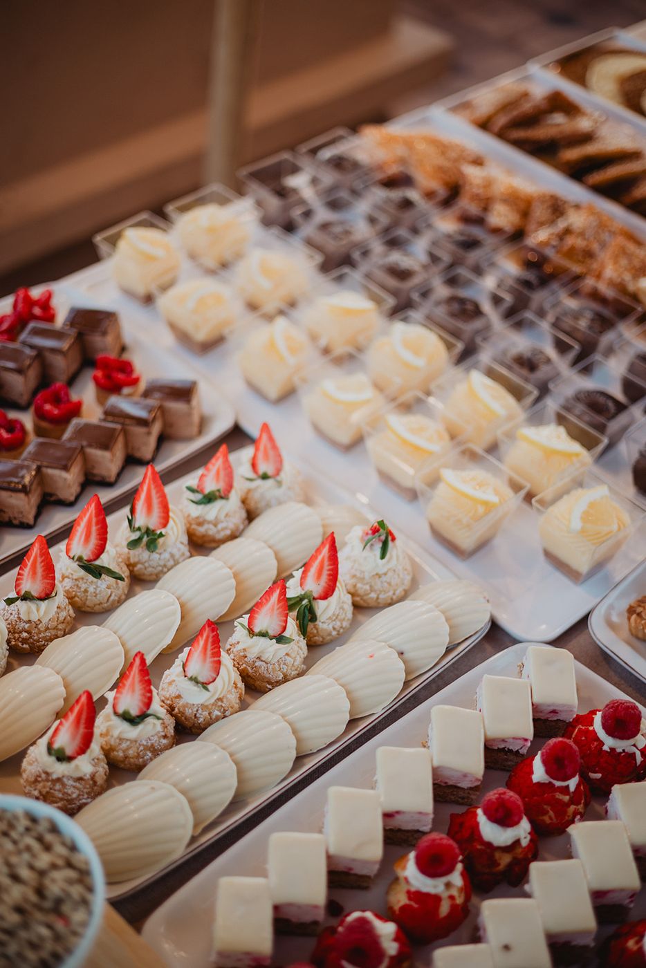 Pastries and petits fours lined up on the buffet